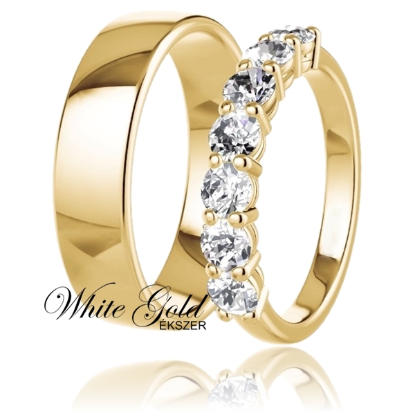 sarga_arany_karikagyuru_18 Elegáns sárga arany karikagyűrű pár, ahol a női gyűrűt nagy méretű, ragyogó kövek sora díszíti, a férfi gyűrű pedig klasszikus, sima felületű kivitelű. A 14 karátos sárga arany gyűrűk a fény és forma tökéletes összhangját képviselik. Letisztult, mégis különleges megjelenésük időtálló választássá teszi őket minden pár számára.